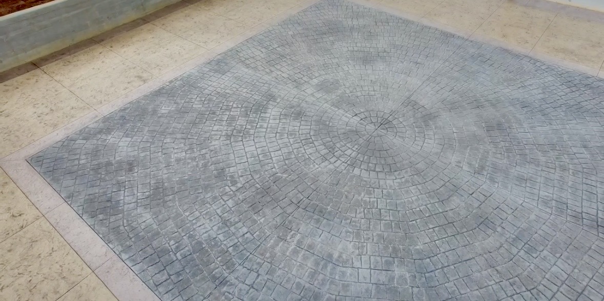 Discover how Alchemy Concrete transformed a Greenville, SC property with a custom-stamped cobblestone medallion, multi-textured zoning, and premium curb appeal.
