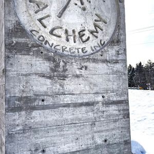 Board Formed Finish with Logo Inlay Concrete Sign