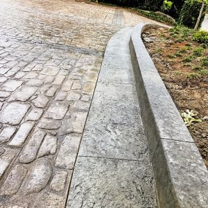 Stamped European Cobblestone with Custom Granite Borders and Curb